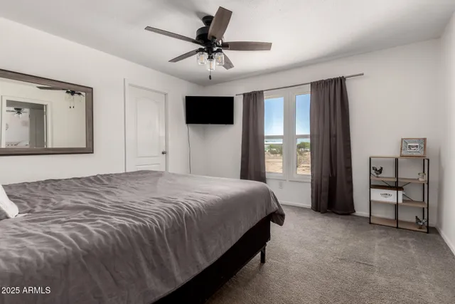 a room with a bed and cabinets