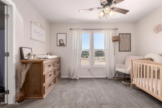 a view of a livingroom with wooden floor and cabinet
