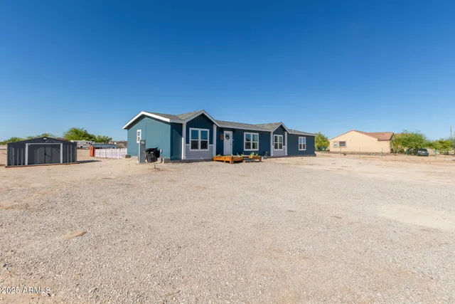 a house with trees in the background