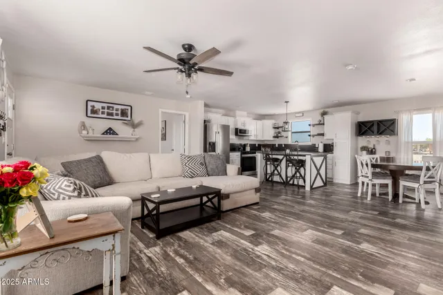 a view of a dining room with furniture and wooden floor