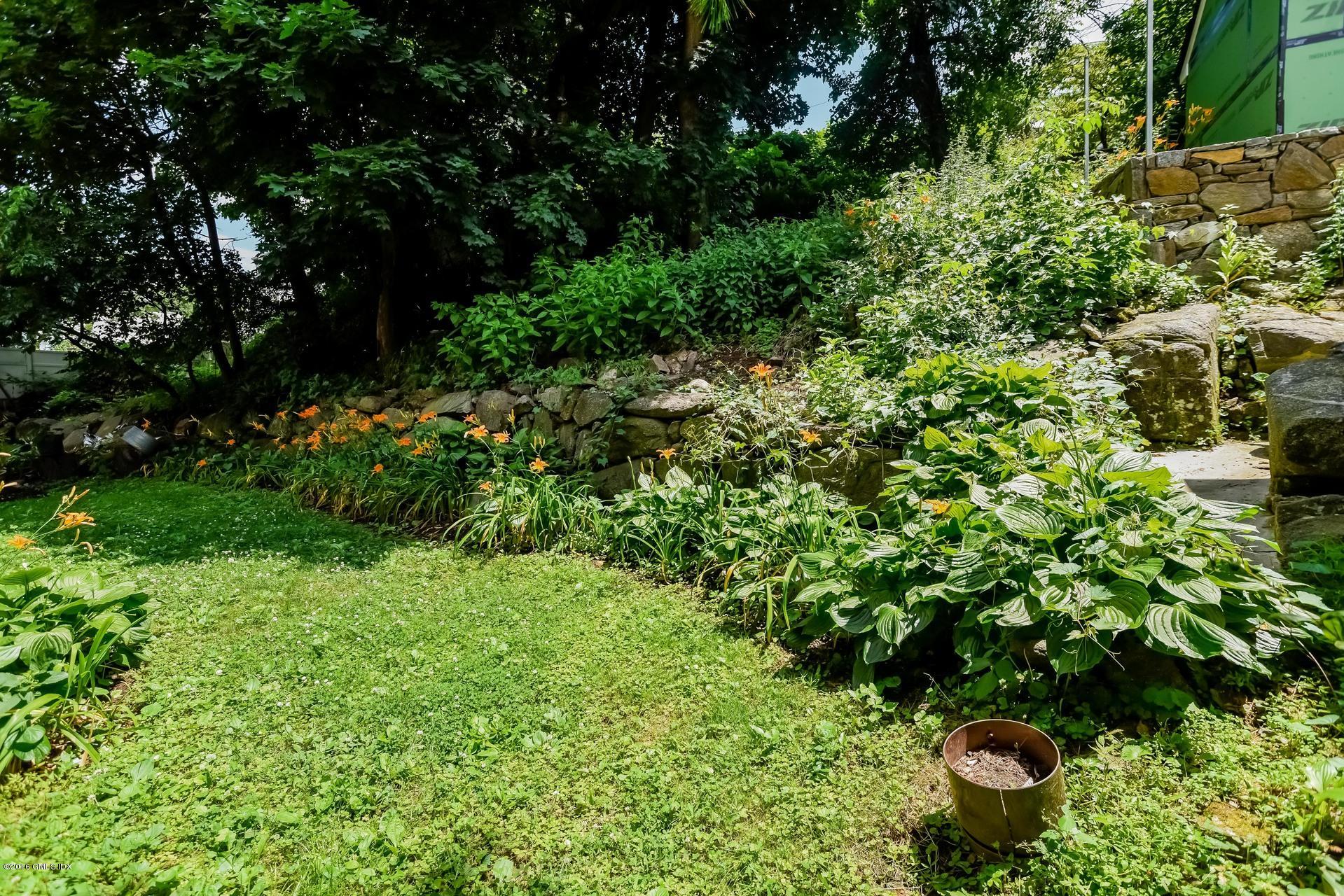 6 Booth Court Greenwich, CT 06830 - Photo 11 of 11 a view of a garden with plants