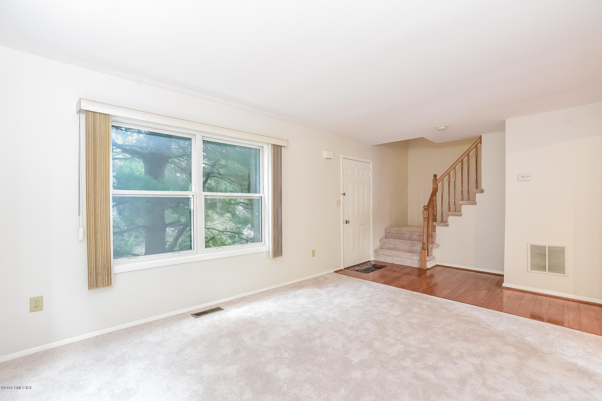 6 Booth Court Greenwich, CT 06830 - Photo 6 of 11 an empty room with windows