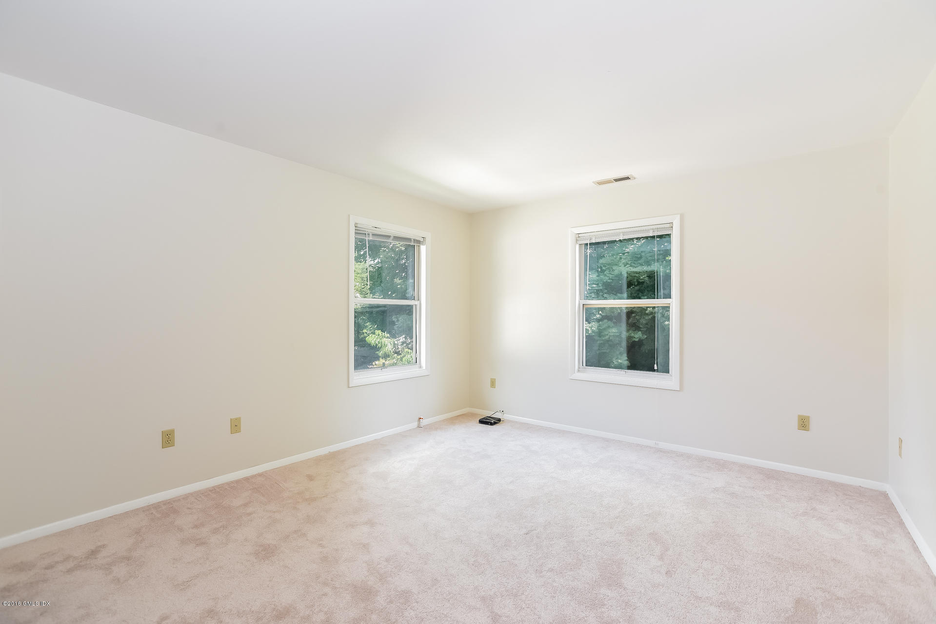 6 Booth Court Greenwich, CT 06830 - Photo 7 of 11 an empty room with windows