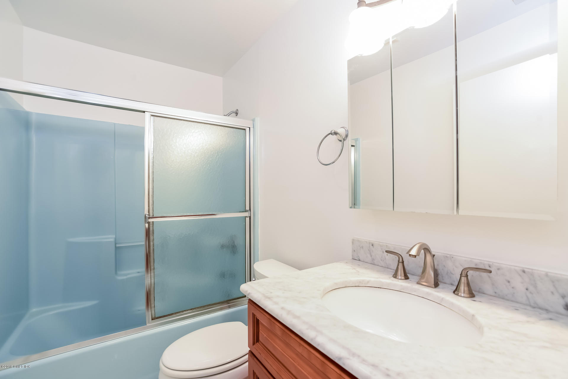 6 Booth Court Greenwich, CT 06830 - Photo 8 of 11 a bathroom with a sink toilet and shower