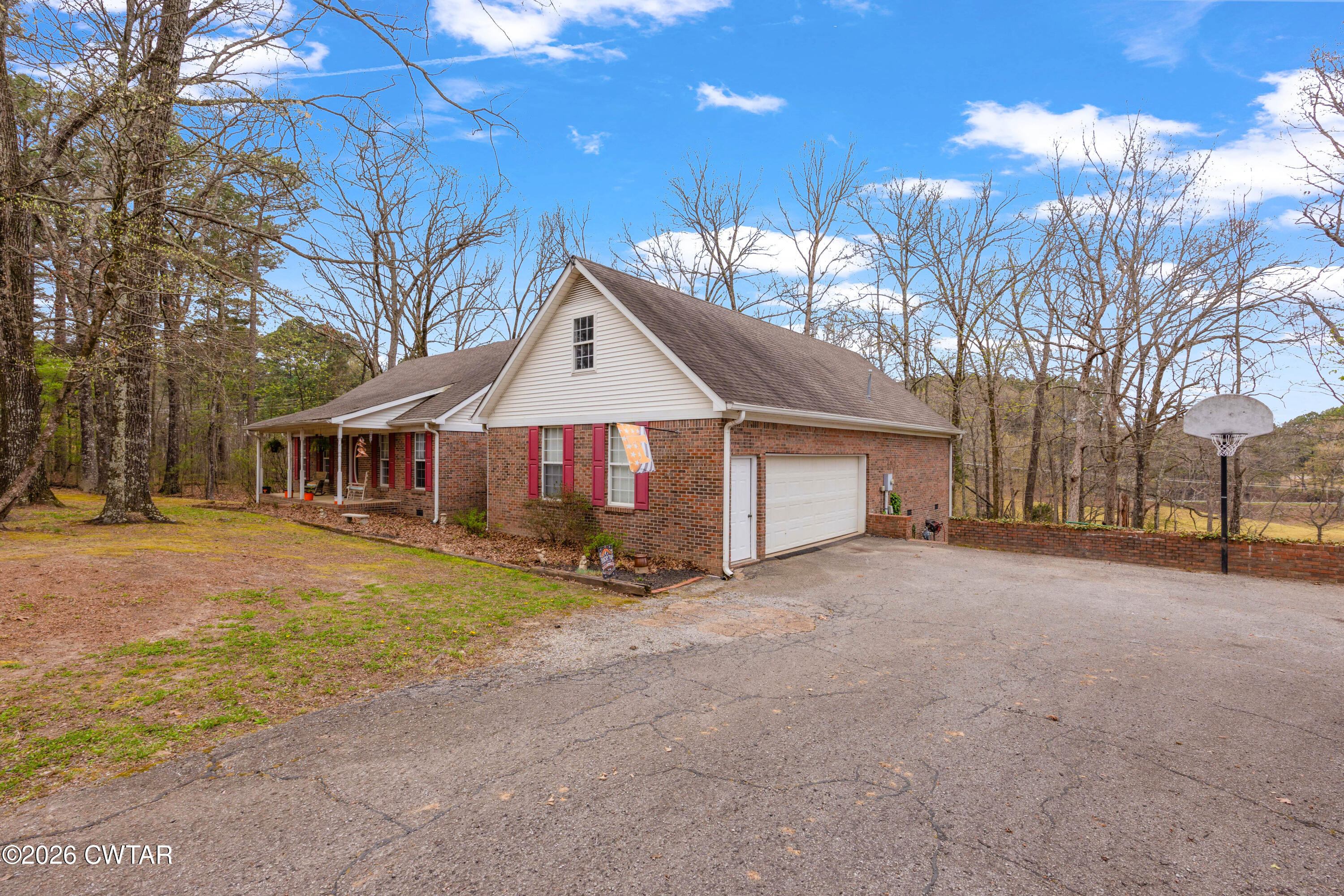 164 Mathis Crossing Road Milan, TN 38358 - Photo 2 of 33 a view of a house with a yard covered in snow