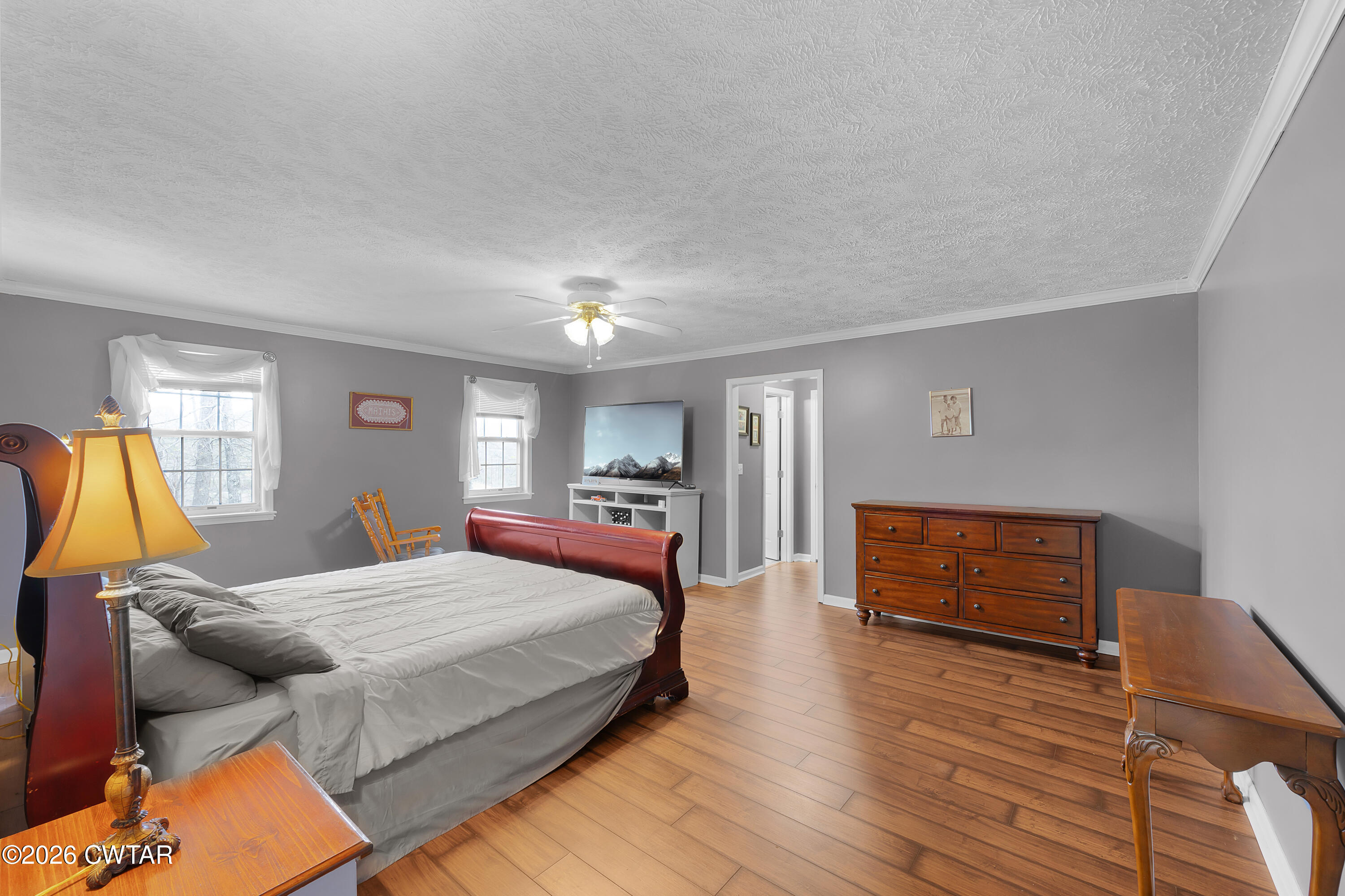 164 Mathis Crossing Road Milan, TN 38358 - Photo 21 of 33 a bedroom with a bed and wooden floor