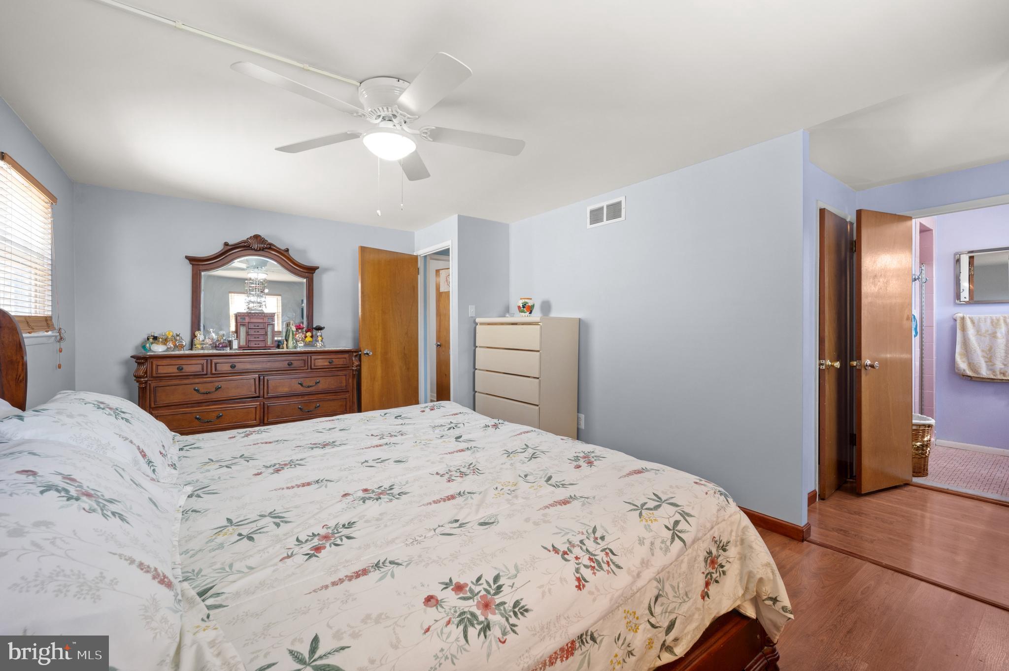 1966 King Arthur Road Philadelphia, PA 19116 - Photo 14 of 35 a bedroom with a large bed and a chandelier