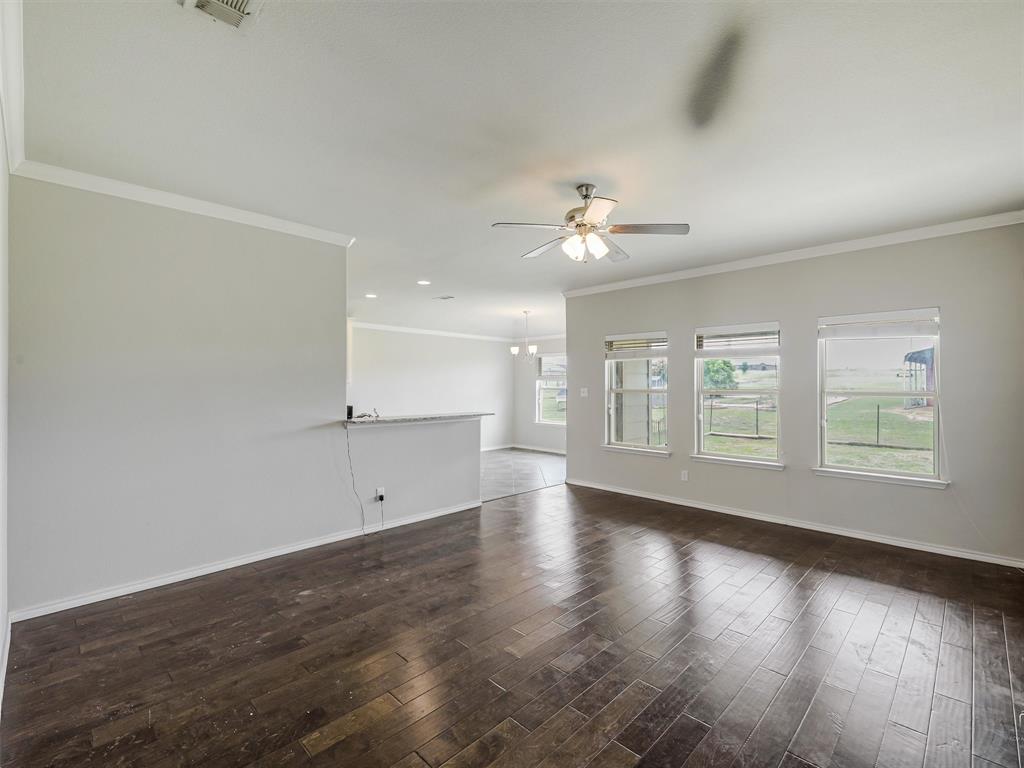 132 County Road 4213 Decatur, TX 76234 - Photo 5 of 27 wooden floor in an empty room with a window