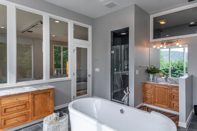 a bathroom with a tub and shower