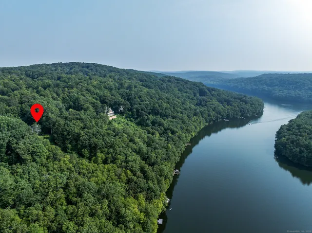 a view of a lake with a yard and mountain
