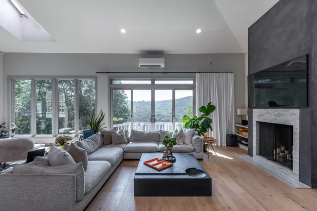 a living room with furniture and a fireplace