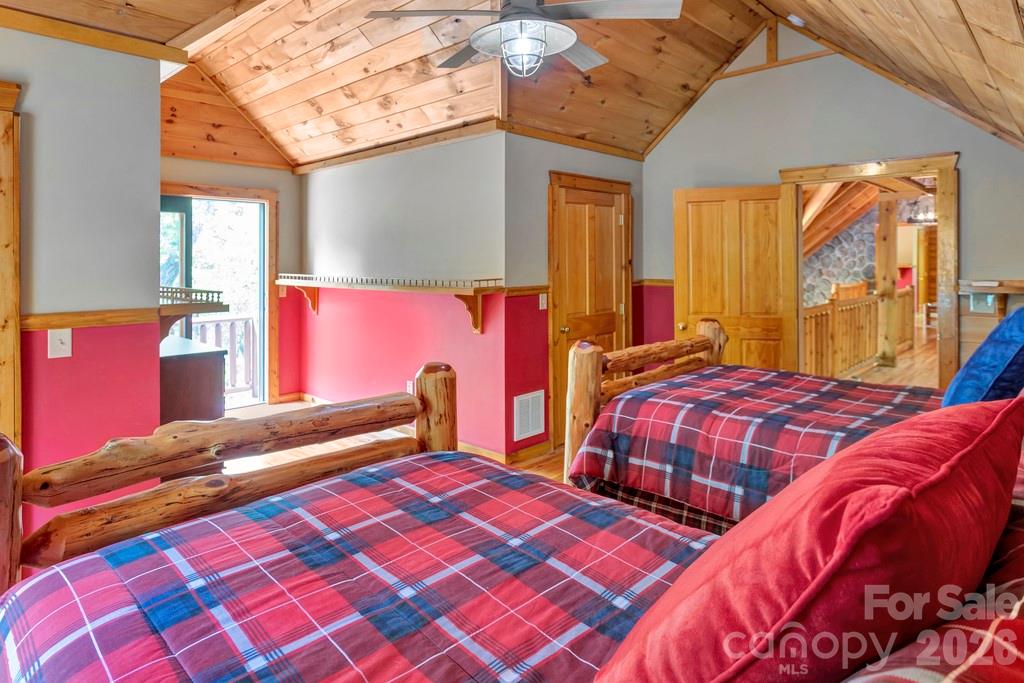 35 Falcon Crest Loop Maggie Valley, NC 28751 - Photo 24 of 46 a bedroom with two beds and a window