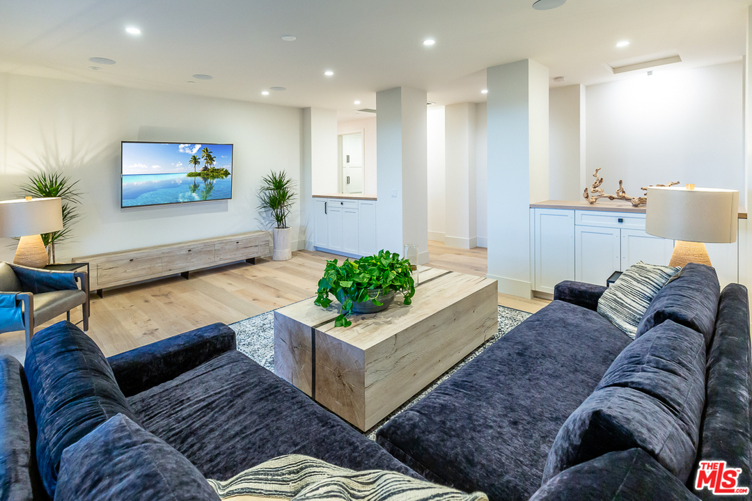 24277 Dry Canyon Cold Creek Road Calabasas, CA 91302 - Photo 23 of 45 a living room with furniture and a flat screen tv