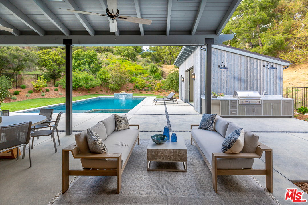24277 Dry Canyon Cold Creek Road Calabasas, CA 91302 - Photo 36 of 45 a outdoor living space with furniture and garden view