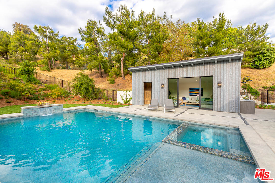 24277 Dry Canyon Cold Creek Road Calabasas, CA 91302 - Photo 37 of 45 a view of swimming pool with outdoor seating and plants
