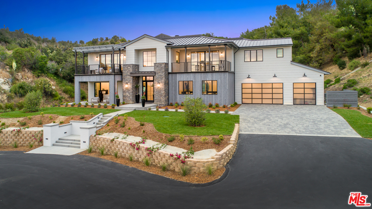 24277 Dry Canyon Cold Creek Road Calabasas, CA 91302 - Photo 45 of 45 a front view of a house with a yard