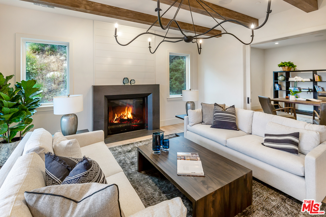 24277 Dry Canyon Cold Creek Road Calabasas, CA 91302 - Photo 7 of 45 a living room with furniture and a fireplace