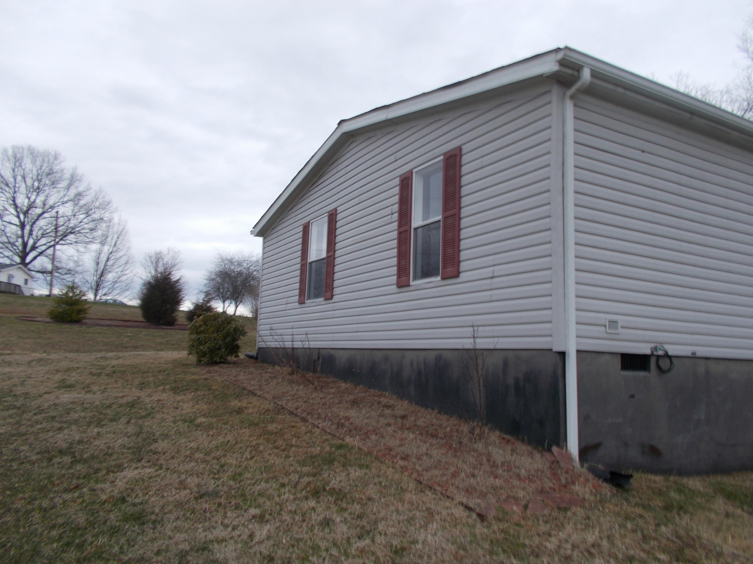 3132 Quarles Road Thaxton, VA 24174 - Photo 12 of 34 a view of a house with a yard