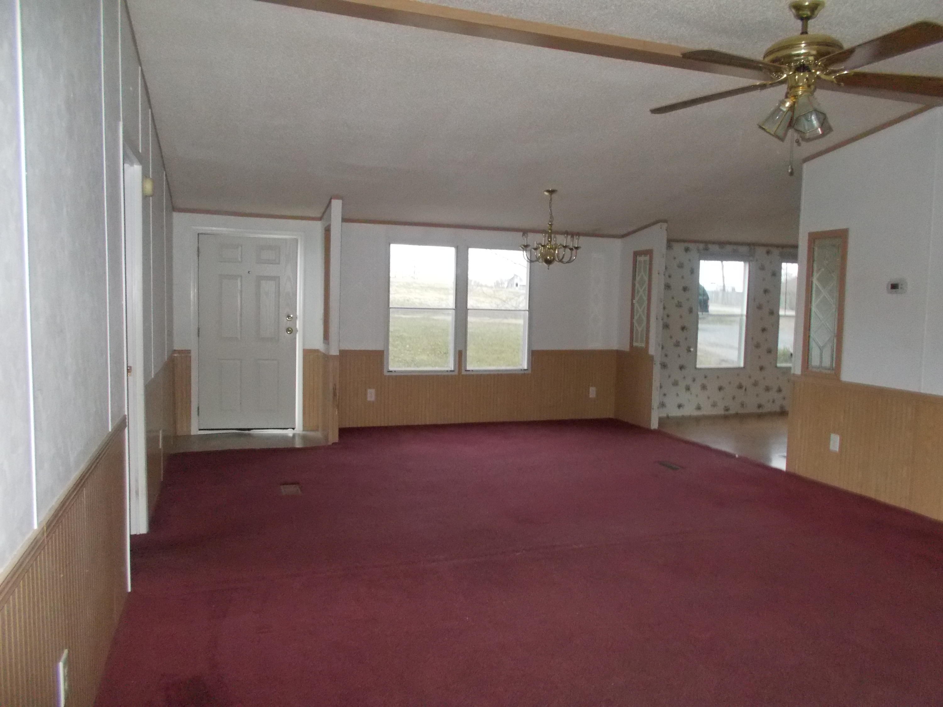 3132 Quarles Road Thaxton, VA 24174 - Photo 15 of 34 an empty room with windows and entrance