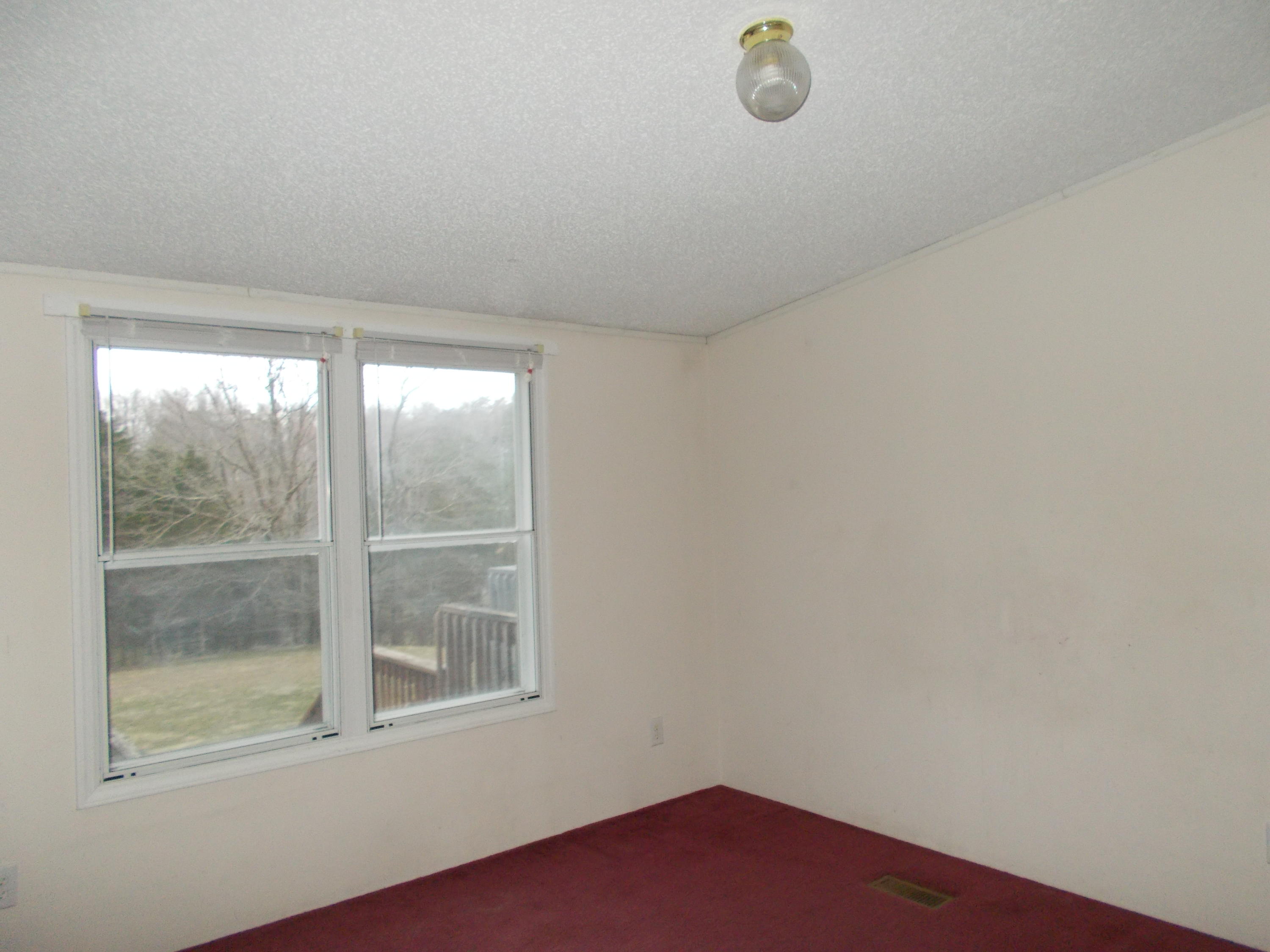 3132 Quarles Road Thaxton, VA 24174 - Photo 21 of 34 a view of empty room with window
