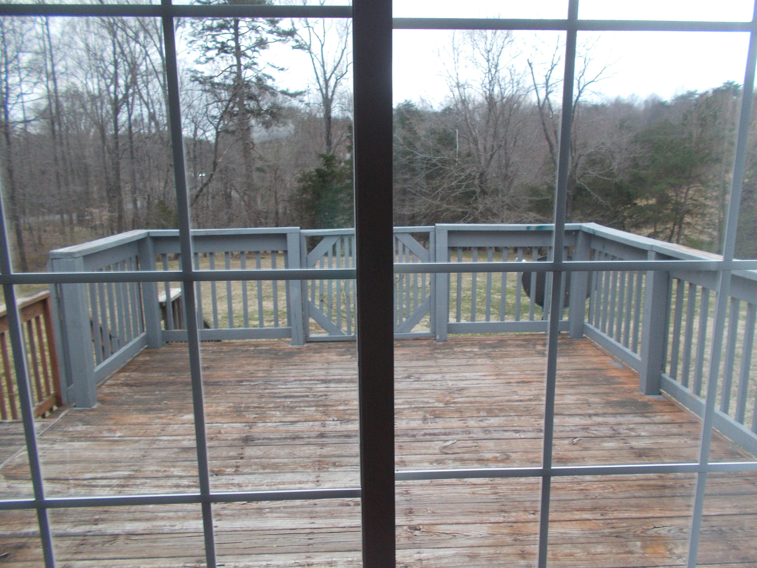 3132 Quarles Road Thaxton, VA 24174 - Photo 34 of 34 a view of a balcony with a floor to ceiling window wooden floor