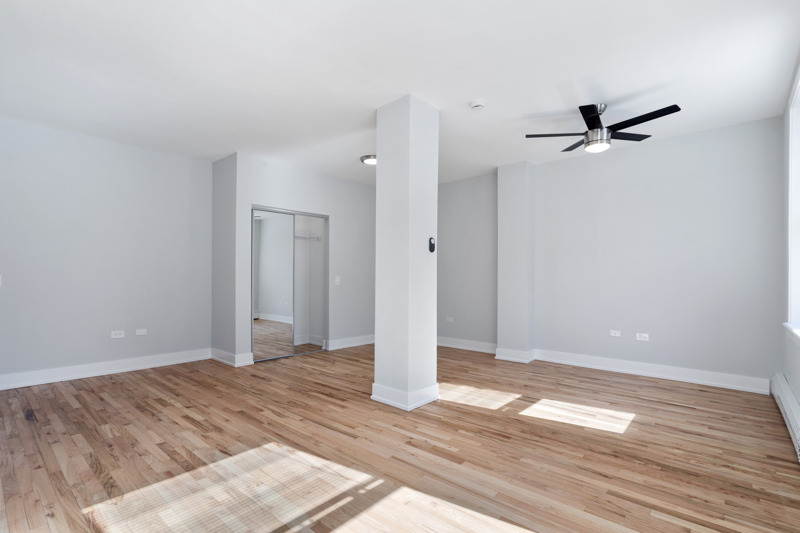1625 West Howard Street, Unit 216 Chicago, IL 60626 - Photo 5 of 9 wooden floor in an empty room