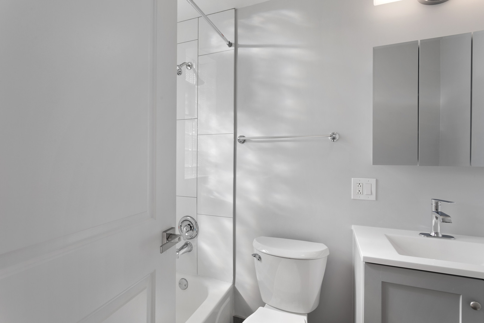 1625 West Howard Street, Unit 216 Chicago, IL 60626 - Photo 8 of 9 a bathroom with a toilet sink and shower