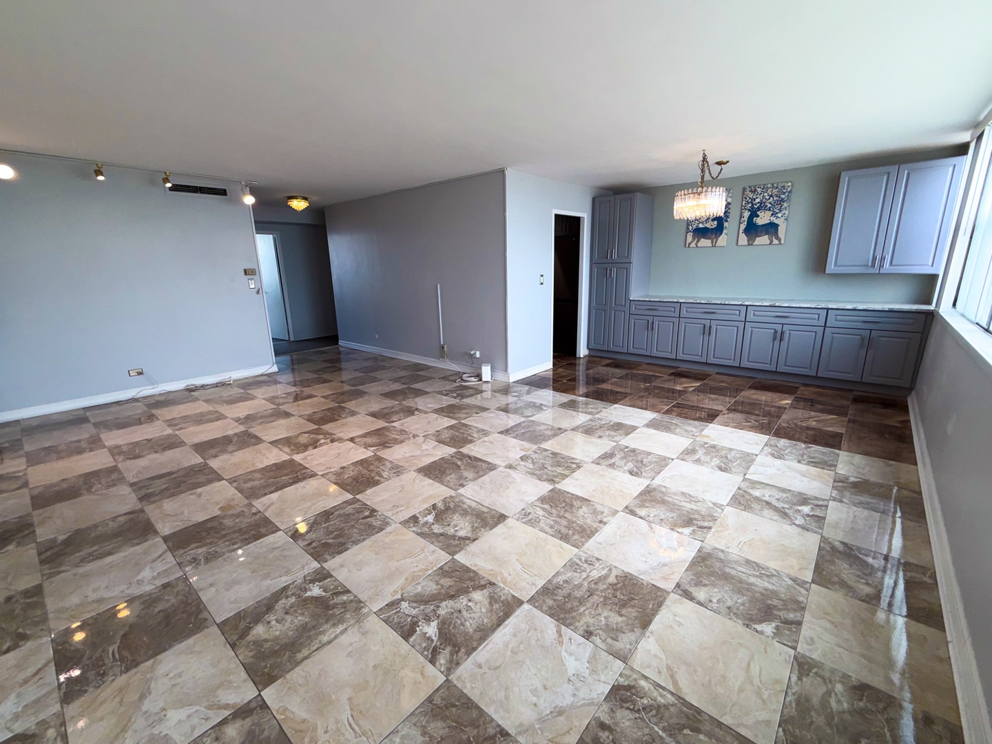 6301 North Sheridan Road, Unit 24E Chicago, IL 60660 - Photo 14 of 52 a view of a kitchen with a sink and a refrigerator