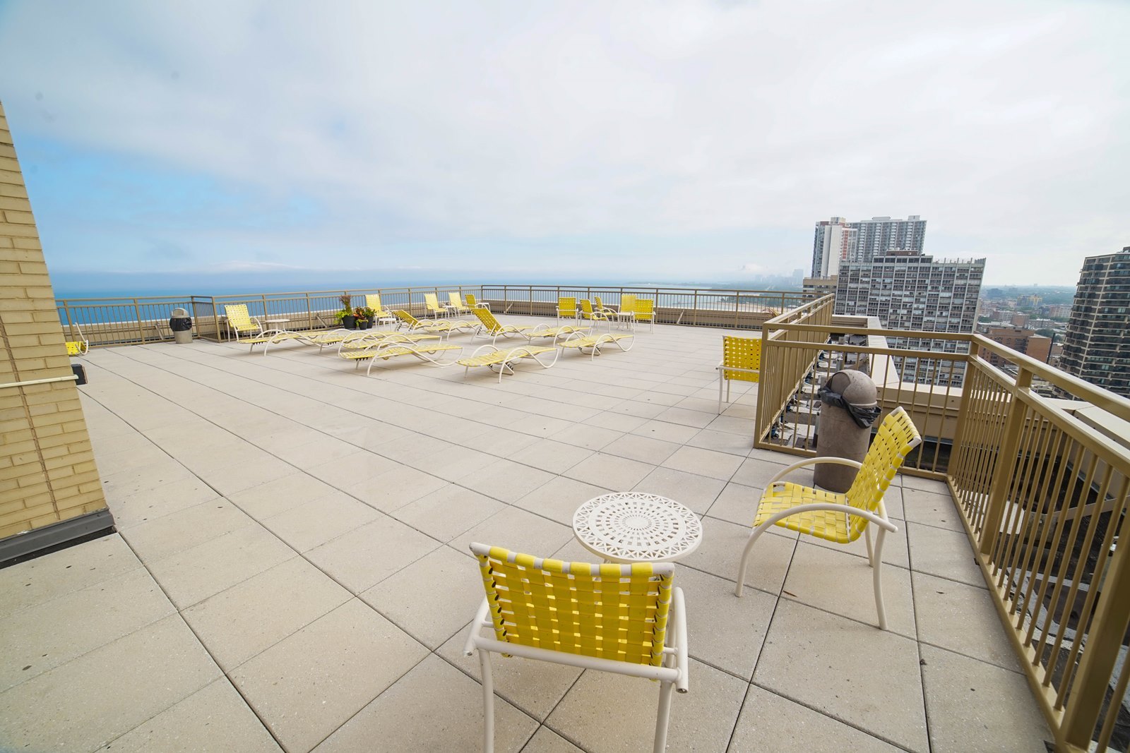 6301 North Sheridan Road, Unit 24E Chicago, IL 60660 - Photo 26 of 52 a view of a terrace with chairs