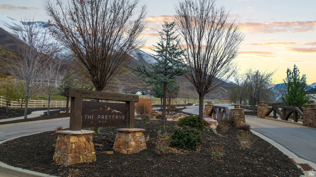 2042 Valley Drive, Unit 57 Mapleton, UT 84664 - Photo 16 of 18 Stone and wood community entrance sign with dark mulch landscaping