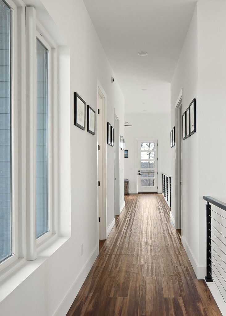1171 Hutchins Bend Road Sparta, TN 38583 - Photo 32 of 74 a view of a hallway with wooden floor and staircase