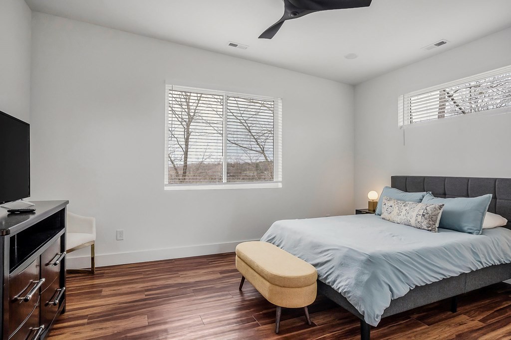 1171 Hutchins Bend Road Sparta, TN 38583 - Photo 37 of 74 a bedroom with a bed and wooden floor
