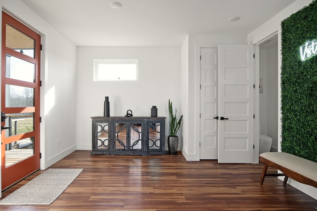 1171 Hutchins Bend Road Sparta, TN 38583 - Photo 4 of 74 a view of a room with wooden floor windows and entryway