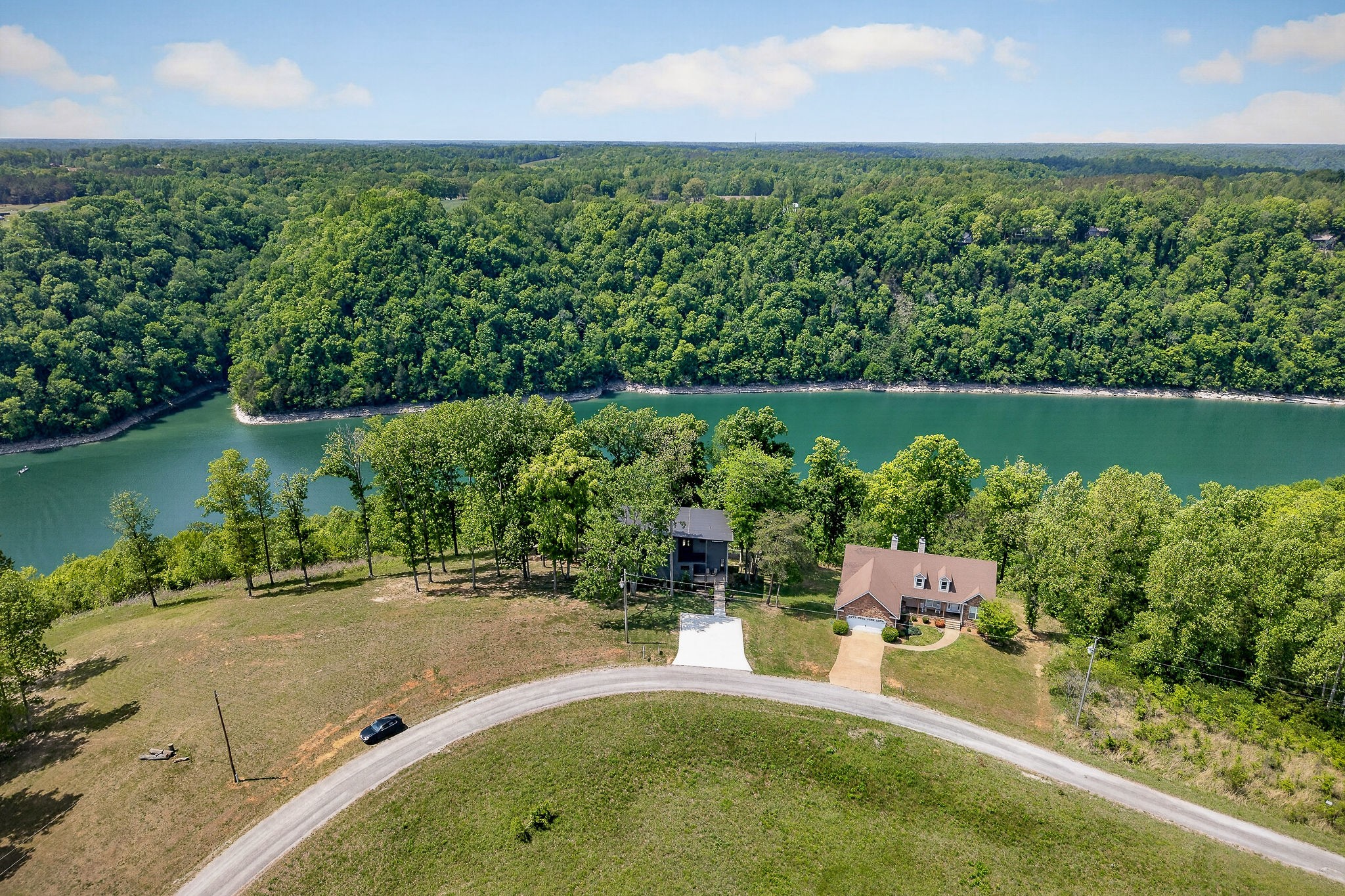 1171 Hutchins Bend Road Sparta, TN 38583 - Photo 66 of 74 an aerial view of a house with a yard and lake view
