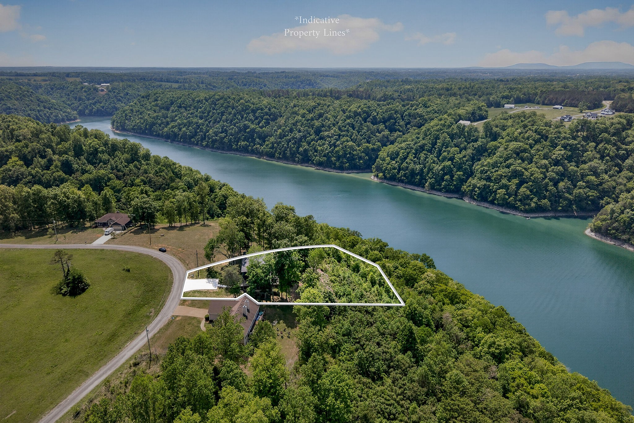 1171 Hutchins Bend Road Sparta, TN 38583 - Photo 69 of 74 an aerial view of a house with a yard and lake view