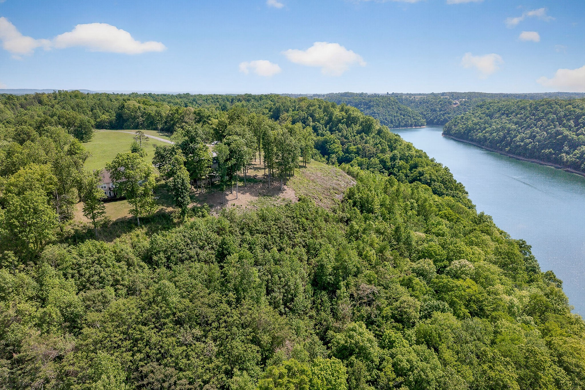1171 Hutchins Bend Road Sparta, TN 38583 - Photo 74 of 74 a view of a lake with a building in the background