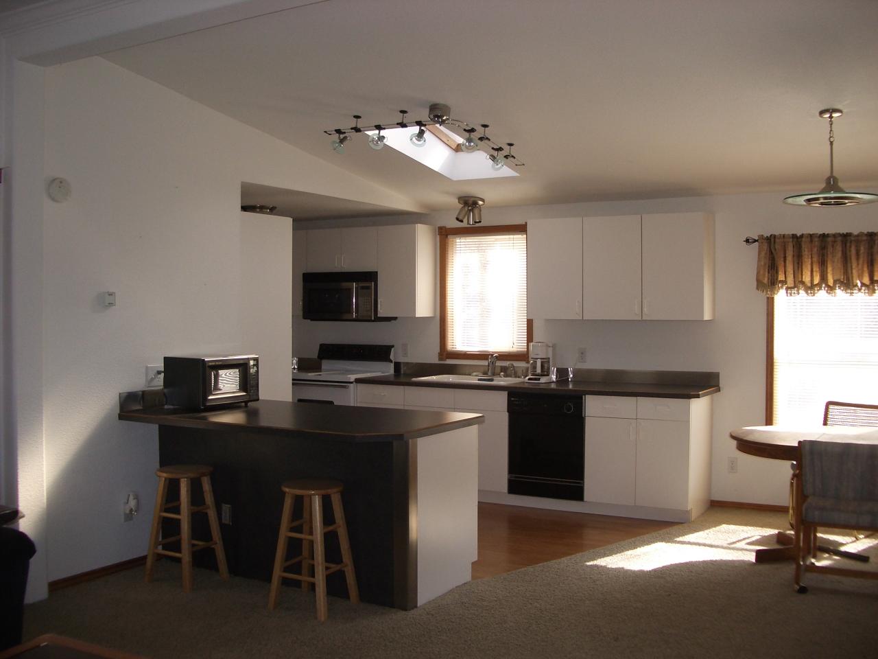 4202 Thorp Road Moxee, WA 98936 - Photo 4 of 8 a kitchen with a sink and stove