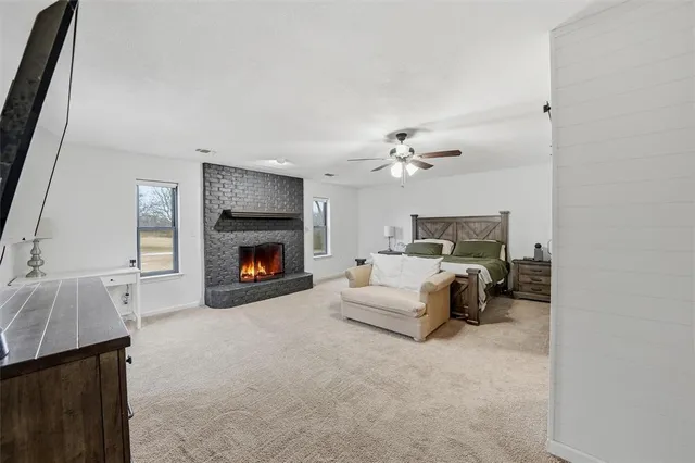 a bed room with a bed and a fireplace