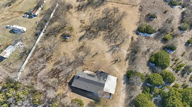 an aerial view of house with yard