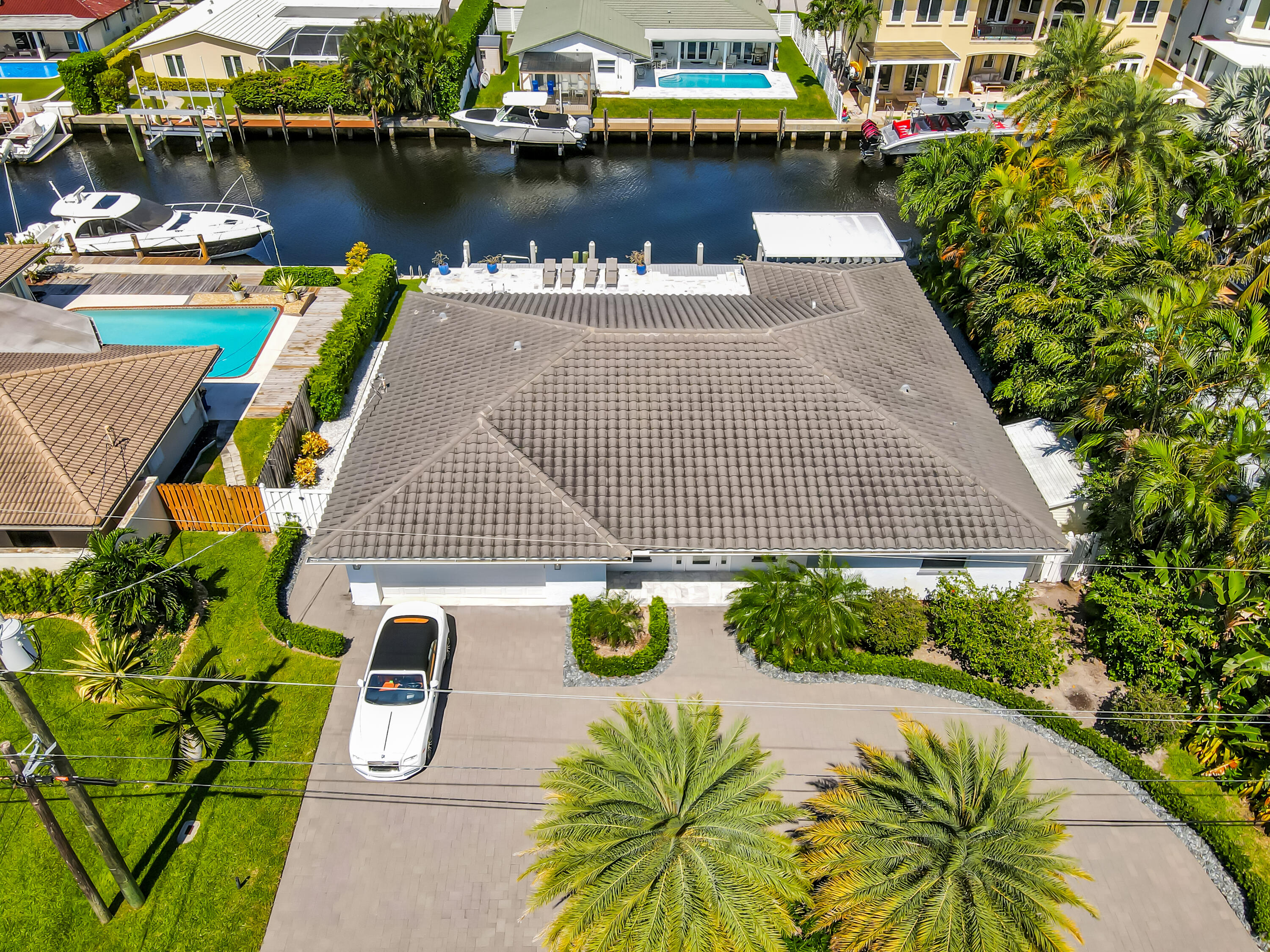 831 Dover Street Boca Raton, FL 33487 - Photo 3 of 71 a aerial view of a house with outdoor seating and lake view