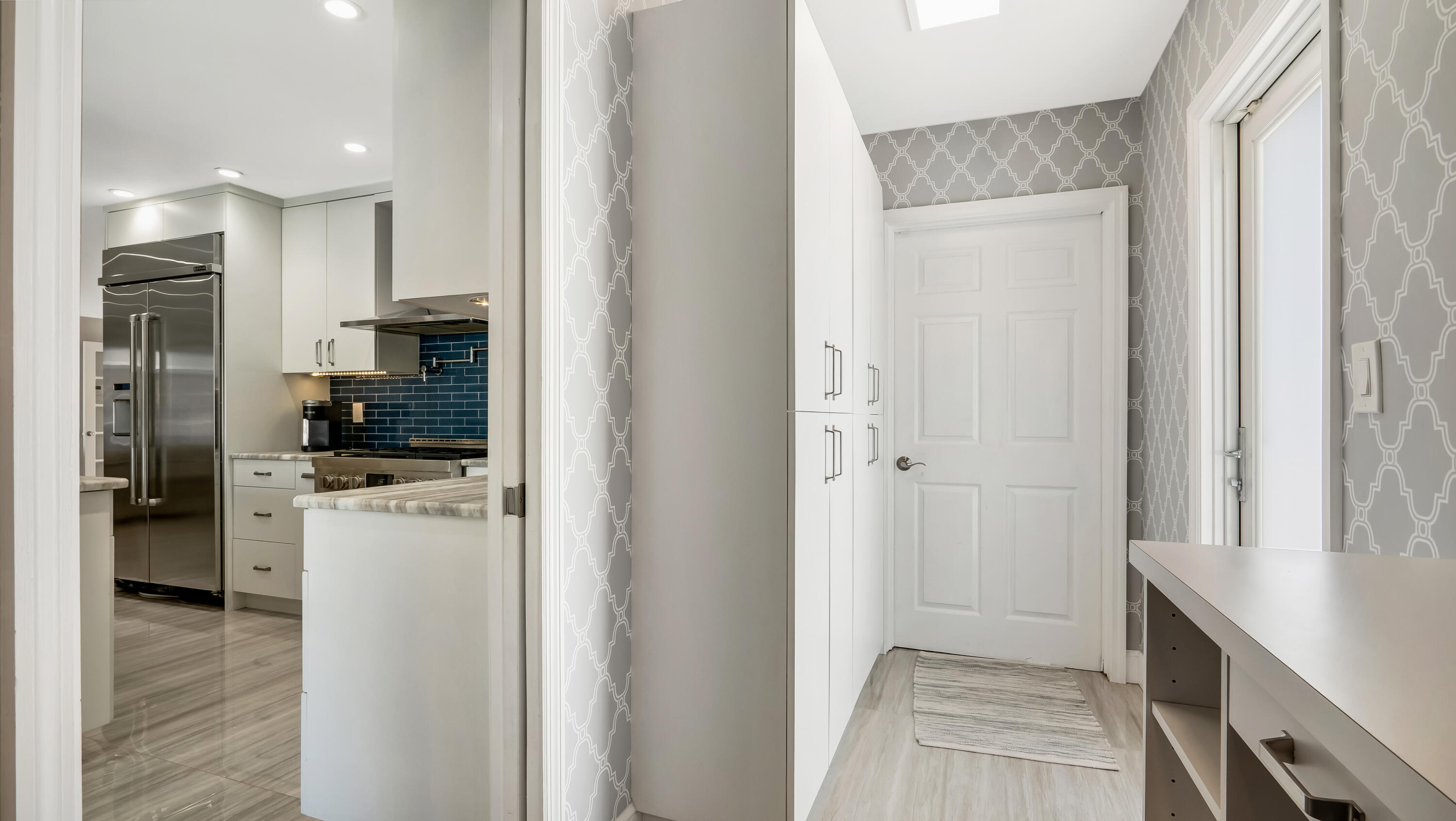831 Dover Street Boca Raton, FL 33487 - Photo 35 of 71 a kitchen with a refrigerator and a stove top oven
