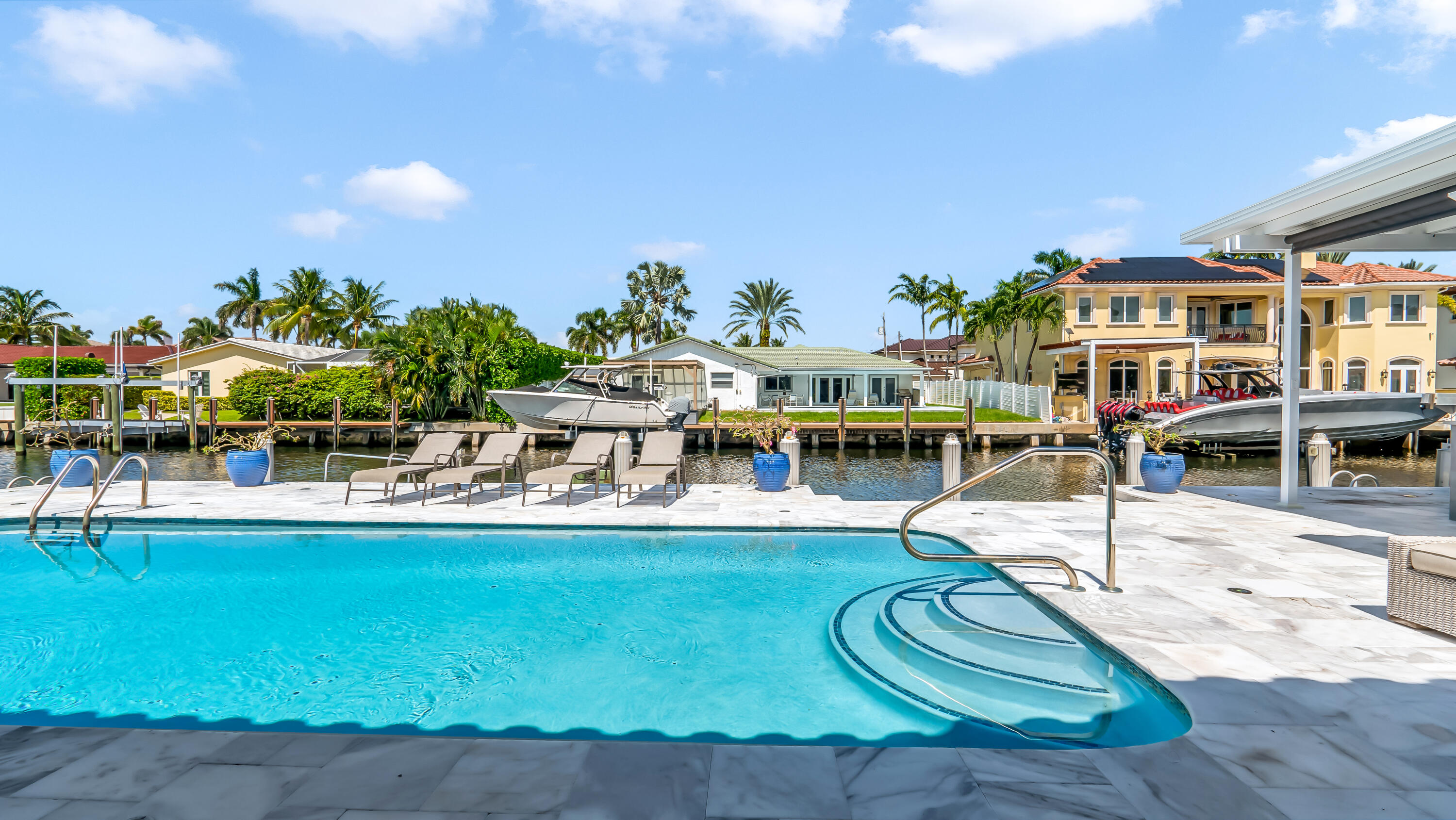 831 Dover Street Boca Raton, FL 33487 - Photo 60 of 71 a view of a swimming pool with outdoor seating