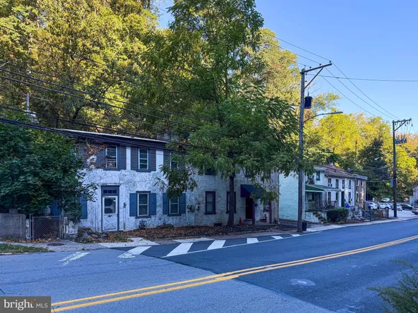 a front view of a building with street view