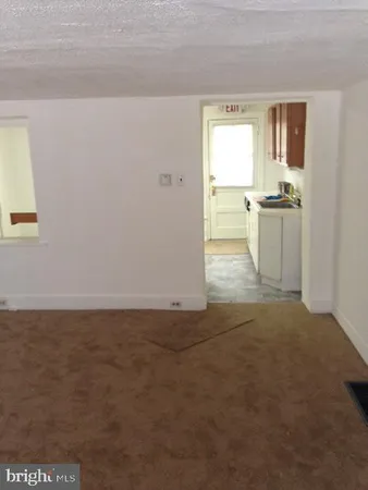 a kitchen with cabinets appliances and a sink
