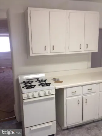 a bathroom with a sink a vanity and a mirror