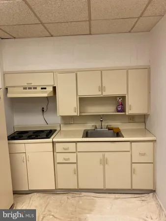 a kitchen with a refrigerator and a stove