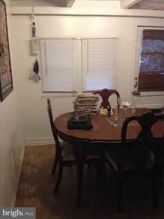 a view of a dining room with furniture and window
