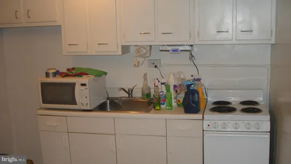 a kitchen with a sink and cabinets