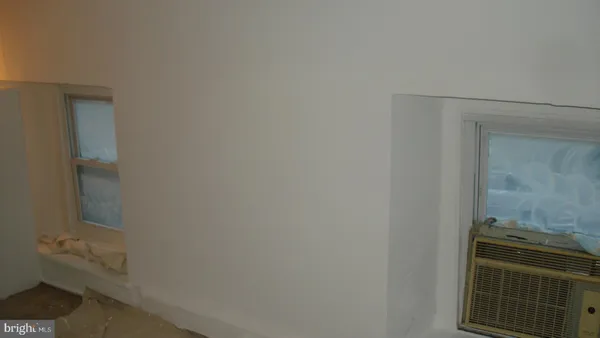 a bathroom with a granite countertop toilet and sink