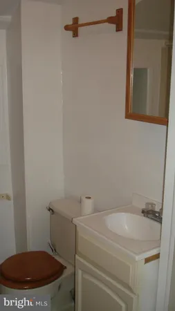 a bathroom with a toilet and a sink